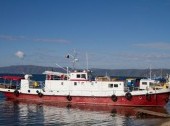 Small ship at the pier in Listvyanka on Lake Baikal