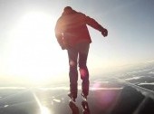 Skating at ice of Lake Baikal